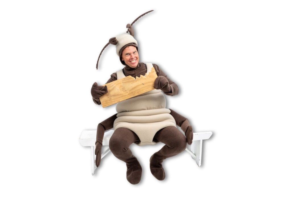 Photo of Carlo in a termite costume eating timber